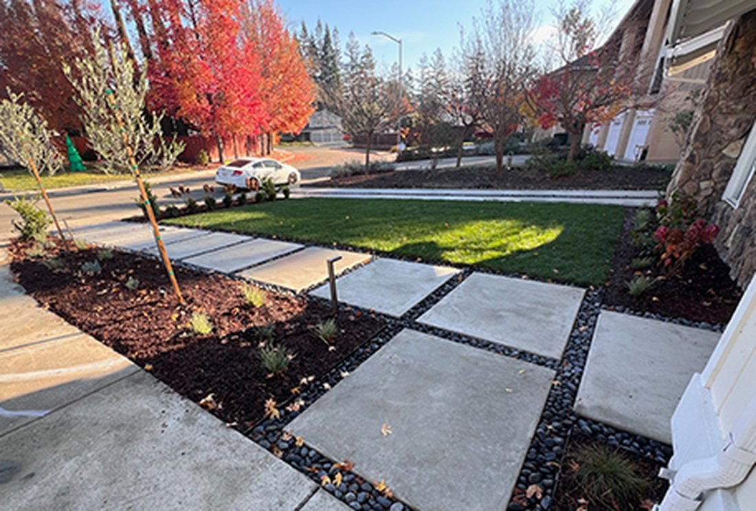 Concrete pavers and gravel entry